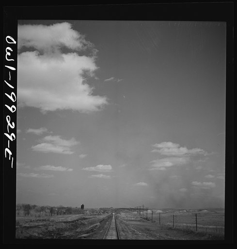 Untitled photo, possibly related to: Miami, Texas. Train stopping for water along the Atchison, Topeka, and Santa Fe Railroad between Canadian and Amarillo, Texas