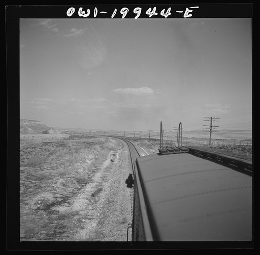 Untitled photo, possibly related to: Hoover, Texas. An Atchison, Topeka, and Santa Fe train stopping to let an east-bound freight go by between Canadian and Amarillo, Texas