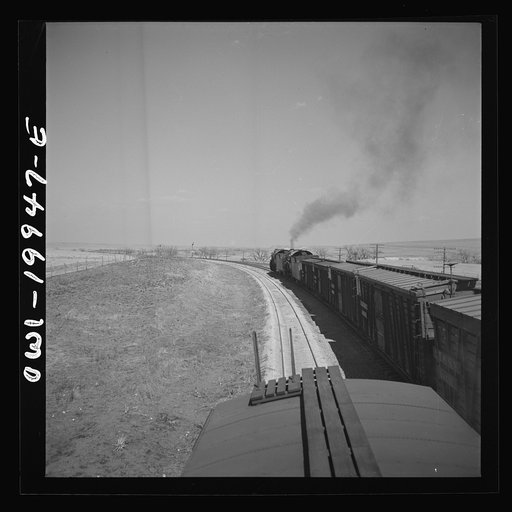 Untitled photo, possibly related to: Hoover, Texas. An Atchison, Topeka, and Santa Fe train stopping to let an east-bound freight go by between Canadian and Amarillo, Texas