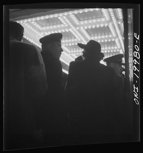 Untitled photo, possibly related to: Washington, D.C. Soldier in front of the Capitol Theatre