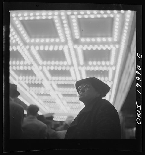 Untitled photo, possibly related to: Washington, D.C. Soldier in front of the Capitol Theatre