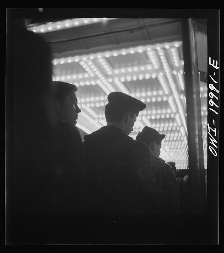 Untitled photo, possibly related to: Washington, D.C. Soldier in front of the Capitol Theatre