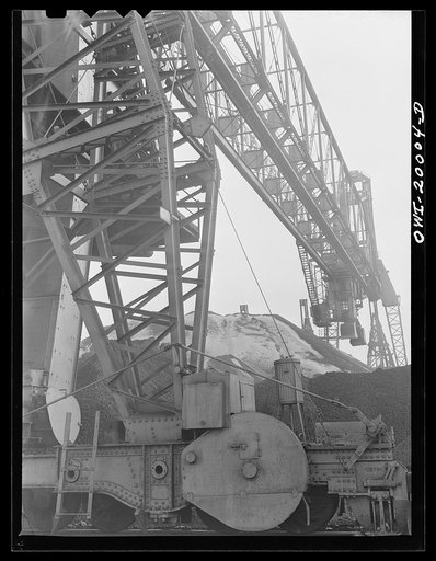Milwaukee Western Fuel Company, Milwaukee, Wisconsin. One of the bridges at the Seventeenth Street dock of the Milwaukee Western Fuel Company with a five-ton coal bucket. The bridge is used for unloading ships, loading cars, keeping coal over the tunnel and loading coal into hoppers