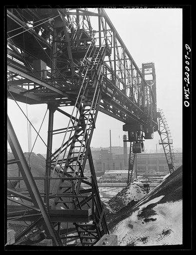 Untitled photo, possibly related to: Milwaukee Western Fuel Company, Milwaukee, Wisconsin. One of the bridges at the Seventeenth Street dock of the Milwaukee Western Fuel Company with a five-ton coal bucket. The bridge is used for unloading ships, loading cars, keeping coal over the tunnel and loadi
