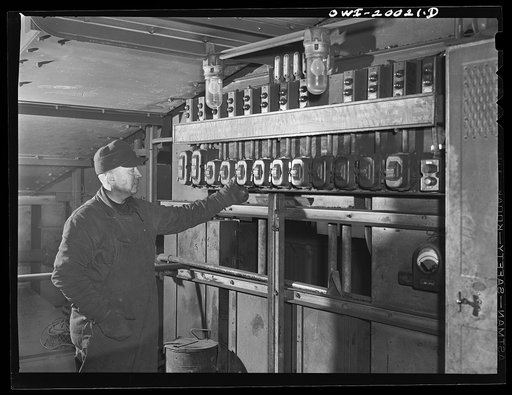 Milwaukee Western Fuel Company, Milwaukee, Wisconsin. Most of the work at the coal docks of the Milwaukee Western Fuel Company is mechanized. This control board is located on top of the processing plant. From here the men control the flow of coal into the hoppers, the speed of the sizing machines, t