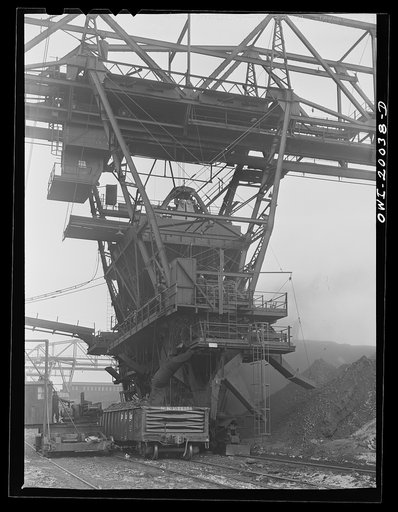 Milwaukee Western Fuel Company. Milwaukee, Wisconsin. The car loading end of a bridge at the Seventeenth Street dock of the Milwaukee Western Fuel Company. The bucket drops coal into the hopper at the top, it is sized over screens, the proper size coal goes down the chute on the left into the car, a