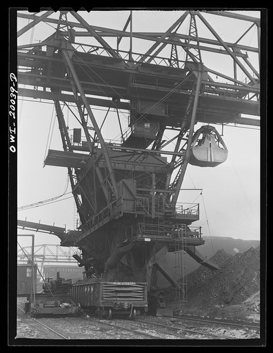Milwaukee Western Fuel Company. Milwaukee, Wisconsin. The car loading end of a bridge at the Seventeenth Street dock of the Milwaukee Western Fuel Company. The bucket drops coal into the hopper at the top, it is sized over screens, the proper size coal goes down the chute on the left into the car, a