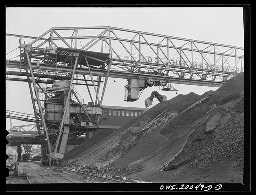 Milwaukee Western Fuel Company, Milwaukee, Wisconsin. One of the bridges at the Seventeenth Street dock of the Milwaukee Western Fuel Company with a five-ton coal bucket. The bridge is used for unloading ships, loading cars, keeping coal over the tunnel and loading coal into hoppers