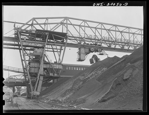 Untitled photo, possibly related to: Milwaukee Western Fuel Company, Milwaukee, Wisconsin. One of the bridges at the Seventeenth Street dock of the Milwaukee Western Fuel Company with a five-ton coal bucket. The bridge is used for unloading ships, loading cars, keeping coal over the tunnel and loadi