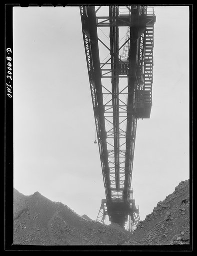 Untitled photo, possibly related to: Milwaukee Western Fuel Company, Milwaukee, Wisconsin. One of the bridges at the Seventeenth Street dock of the Milwaukee Western Fuel Company with a five ton coal bucket. The bridge is used for unloading ships, loading cars, keeping coal over the tunnel and loadi