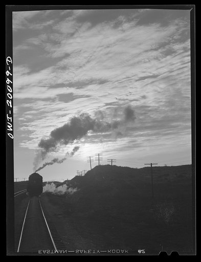 Untitled photo, possibly related to: Curtis, Oklahoma. Helper engine leaving an Atchison, Topeka and Santa Fe train early in the morning after having helped push it from Belva, Oklahoma