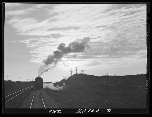 Untitled photo, possibly related to: Curtis, Oklahoma. Helper engine leaving an Atchison, Topeka and Santa Fe train early in the morning after having helped push it from Belva, Oklahoma