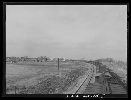 Capron, Oklahoma. An Atchison, Topeka and Santa Fe train stopping for water, enroute to Waynoka, Oklahoma