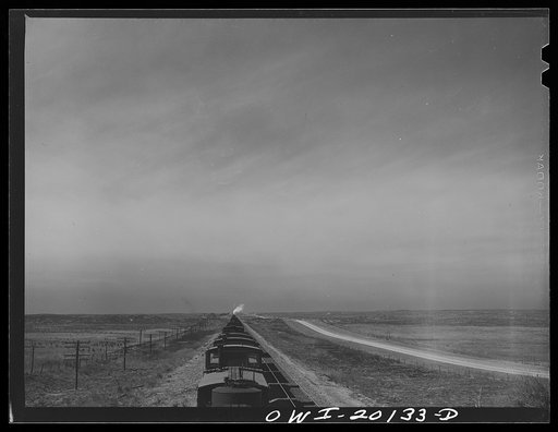 Untitled photo, possibly related to: Farm lands and oil storage tanks west of Pampa, Texas along the tracks of the Atchison, Topeka and Santa Fe Railroad