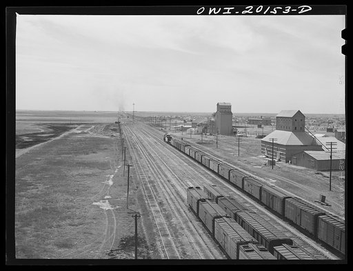 Amarillo, Texas. An eastbound Atchison, Topeka and Santa Fe freight train pulling out of the yard