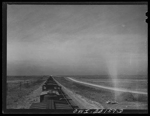 Untitled photo, possibly related to: Farm lands and oil storage tanks west of Pampa, Texas along the tracks of the Atchison, Topeka and Santa Fe Railroad