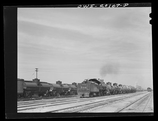 Untitled photo, possibly related to: Amarillo, Texas. An eastbound Atchison, Topeka and Santa Fe freight train pulling out of the yard