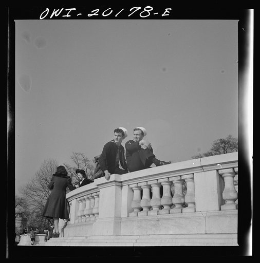 Washington, D.C. Sailors sitting on a monument in front of the Capitol on Sunday
