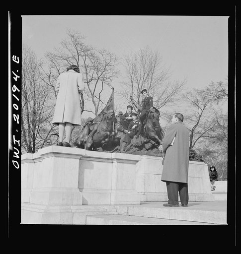 Washington, D.C. Taking pictures on the steps of a monument in front of the Capitol on a Sunday afternoon