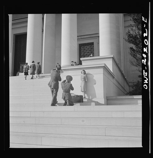 Washington, D.C. Taking pictures of a girl on the steps of the National Gallery of Art on a Sunday afternoon