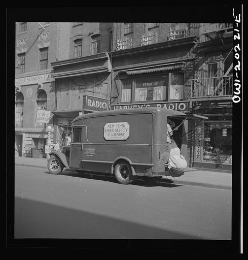 New York, New York. A linen supply truck on Forty-fourth Street