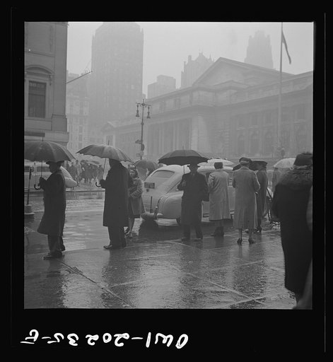 New York, New York. Forty-second Street and Fifth Avenue on a rainy day