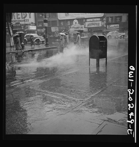 Untitled photo, possibly related to: New York, New York. Steam rising from the pavement on a rainy day