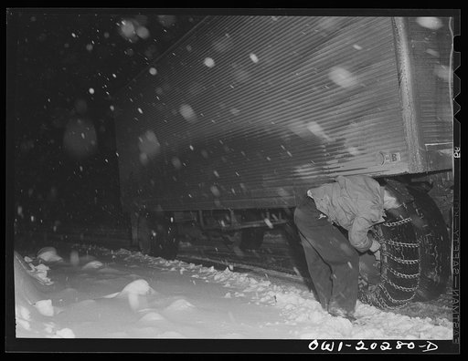 Untitled photo, possibly related to: Jim Fletcher stopping to put on chains while crossing the Blue Ridge Mountains in Tennessee during a snow storm