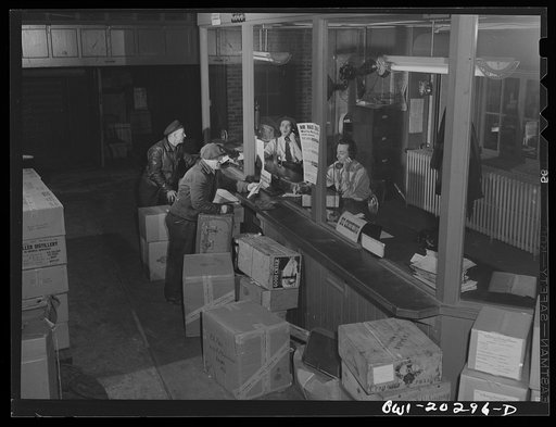 Baltimore, Maryland. Truck drivers getting their orders to go out at the dispatcher's office