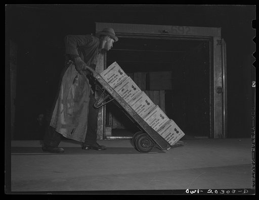 Baltimore, Maryland. Loading ammunition onto a truck at the Davidson truck terminal