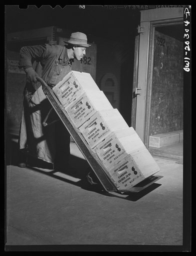 Untitled photo, possibly related to: Baltimore, Maryland. Loading ammunition onto a truck at the Davidson truck terminal