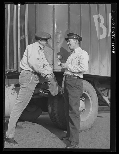 Ben Sams and Noah Booher, truck drivers for the Associated Transport Company stopping for a talk along the road, near Roanoke, Virginia