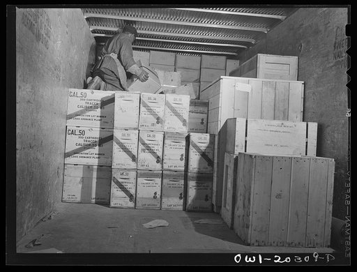 Baltimore, Maryland. Loading ammunition onto a truck at the Davidson truck terminal