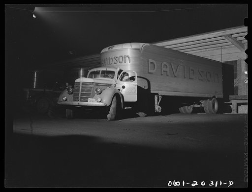 Baltimore, Maryland. A yard jockey backing up a truck, which has just come into the unloading platform at the Davidson truck terminal
