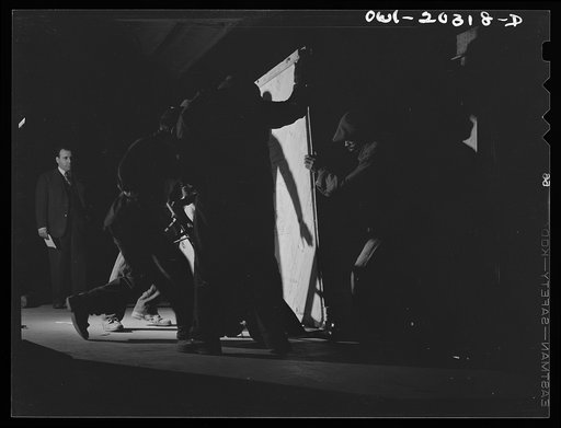 Untitled photo, possibly related to: Baltimore, Maryland. Platform workers crated machinery onto a truck at the Davidson truck terminal