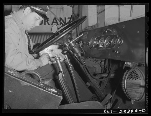 Bob Daugherty, a driver for the Associated Transport Company, working on his log book after stopping for coffee. Interstate Commerce Commission regulations require time records from all truck drivers