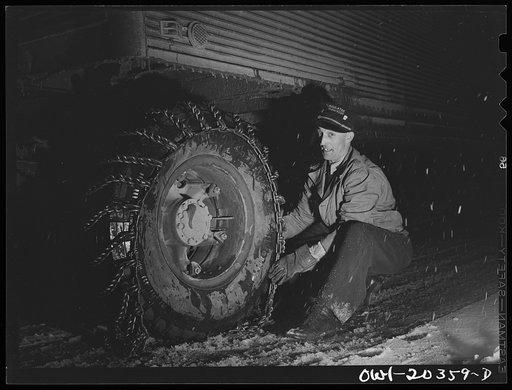 Untitled photo, possibly related to: Jim Fletcher stopping to put on chains while crossing the Blue Ridge Mountains in Tennessee during a snow storm