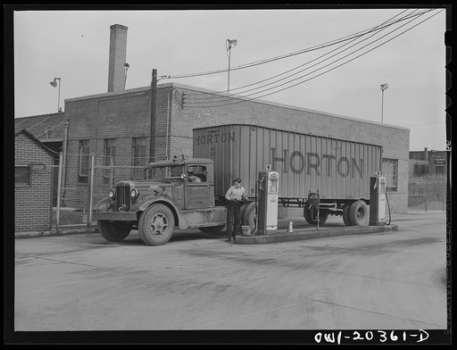 Untitled photo, possibly related to: Washington, D.C. Putting gas in a truck at the Associated Transport Company terminal