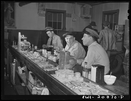 Sam Bens and Noah Booher, drivers for Associated Transport Company having dinner with a textile mill truck driver at a highway stop along U.S. Highway Route no. 11 near Wytheville, Virginia