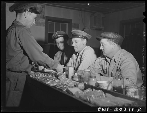 Untitled photo, possibly related to: Sam Bens and Noah Booher, drivers for Associated Transport Company having dinner with a textile mill truck driver at a highway stop along U.S. Highway Route no. 11 near Wytheville, Virginia