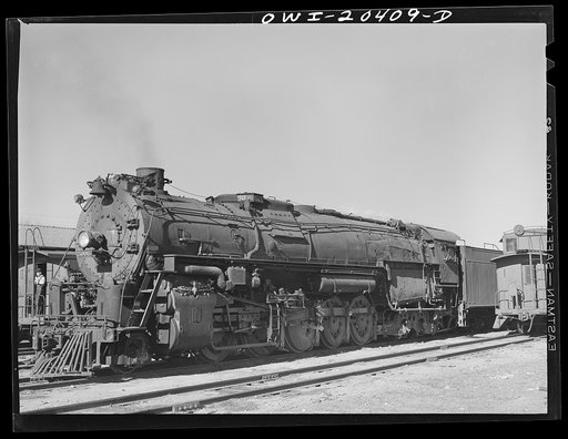 Vaughn, New Mexico. One of the 5000 Class Atchison, Topeka and Santa Fe Railroad freight locomotives about to leave on the run to Clovis, New Mexico