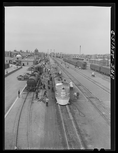 Albuquerque, New Mexico. The Atchison, Topeka and Santa Fe Railroad streamliner "Super Chief" stopping for five minutes' servicing at the depot