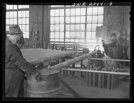 Albuquerque, New Mexico. Electric welding of flues in the Atchison, Topeka and Santa Fe Railroad flue shop. Old flues are reclaimed, worn ends cut off and new ones welded on
