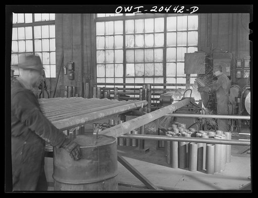 Untitled photo, possibly related to: Albuquerque, New Mexico. Electric welding of flues in the Atchison, Topeka and Santa Fe Railroad flue shop. Old flues are reclaimed, worn ends cut off and new ones welded on