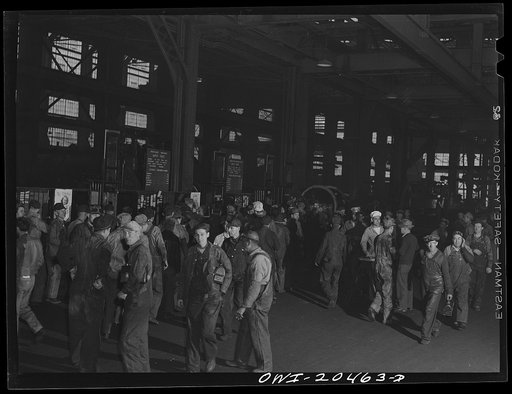 Albuquerque, New Mexico. Men checking out for lunch at the Atchison, Topeka and Santa Fe locomotive shops