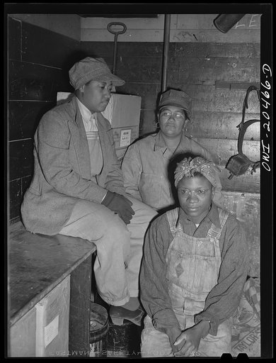 Clovis, New Mexico. Left to right: Lorraine Panol, Felecia Jones and Vera Edmore, car cleaners employed at the Clovis yard of the Atchison, Topeka and Santa Fe Railroad