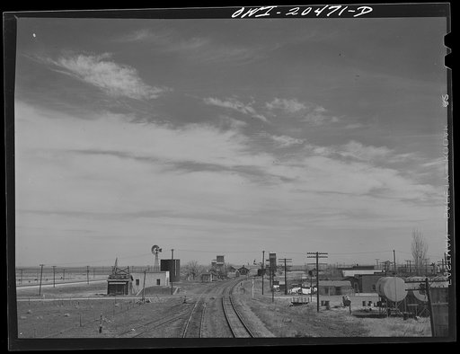 Fort Sumner (vicinity), New Mexico. Passing through a small town on the Atchison, Topeka and Santa Fe Railroad in the Pecos River Valley enroute to Vaughn, New Mexico