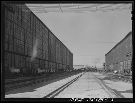 Untitled photo, possibly related to: Albuquerque, New Mexico. A completely overhauled engine on the transfer table at the Atchison, Topeka and Santa Fe Railroad locomotive shops. It is now ready to go to service