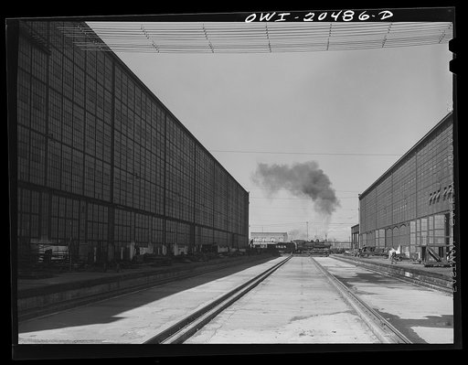 Untitled photo, possibly related to: Albuquerque, New Mexico. A completely overhauled engine on the transfer table at the Atchison, Topeka and Santa Fe Railroad locomotive shops. It is now ready to go to service