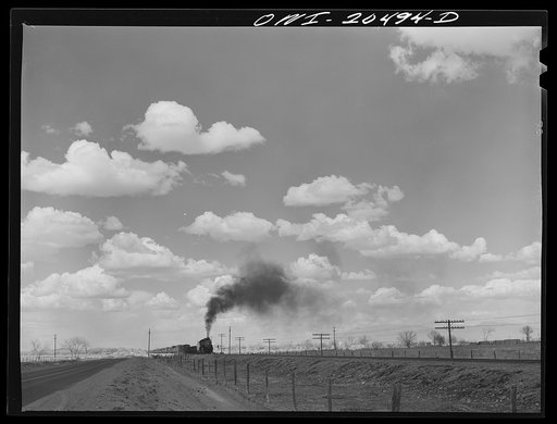 Los Lunas, New Mexico. A westbound Atchison, Topeka and Santa Fe Railroad freight train out of Albuquerque, New Mexico